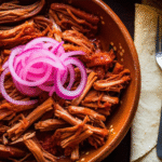 Cochinita Pibil: Sabor Ancestral do Yucatán